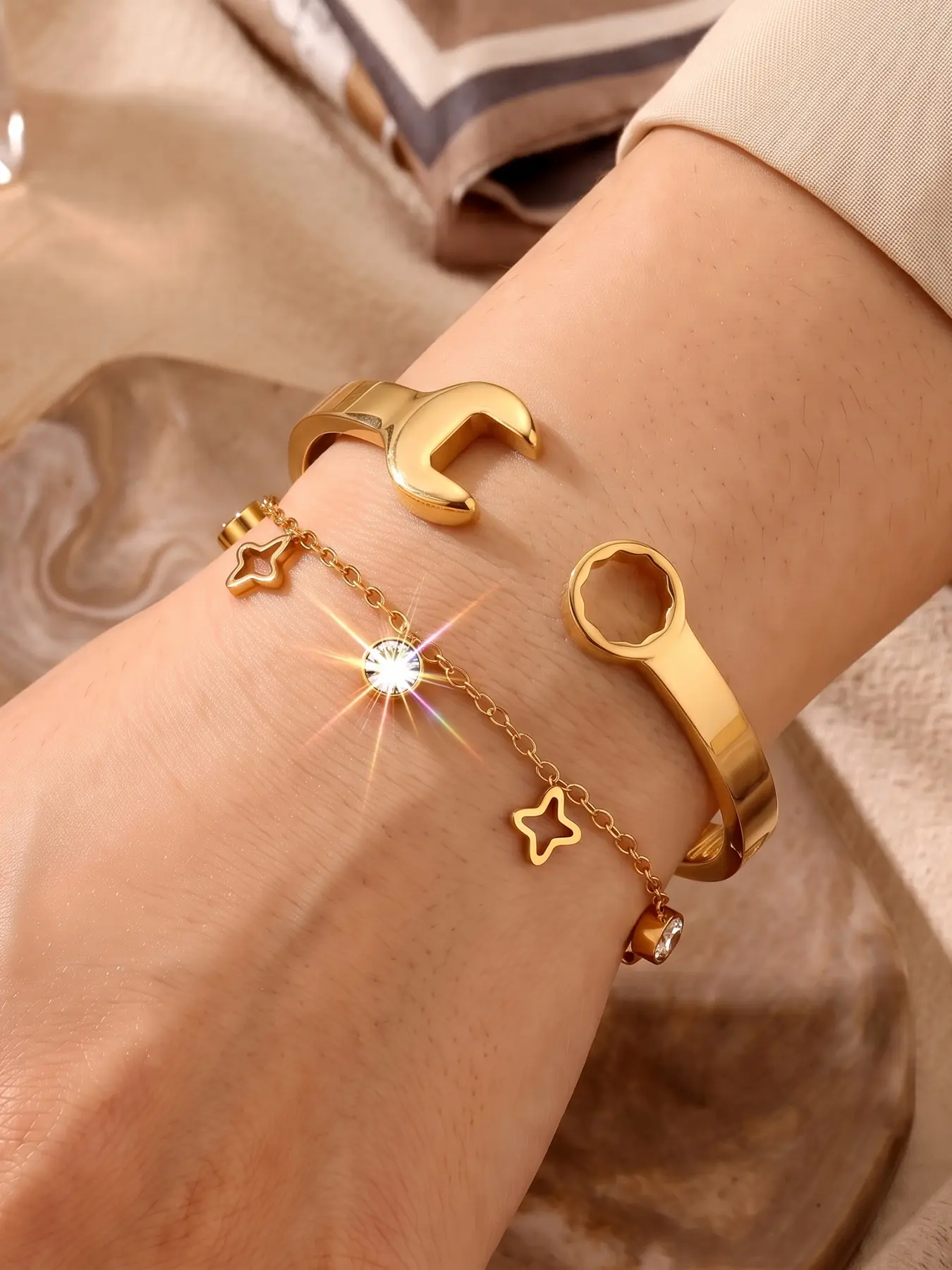 2pcs Creative Wrench Bracelet and Tetrahedron Necklace Set, featuring a gleaming golden finish with an industrial-style design. The unique aesthetic blends edgy coolness with delicate beauty, offering a niche look that stands out effortlessly