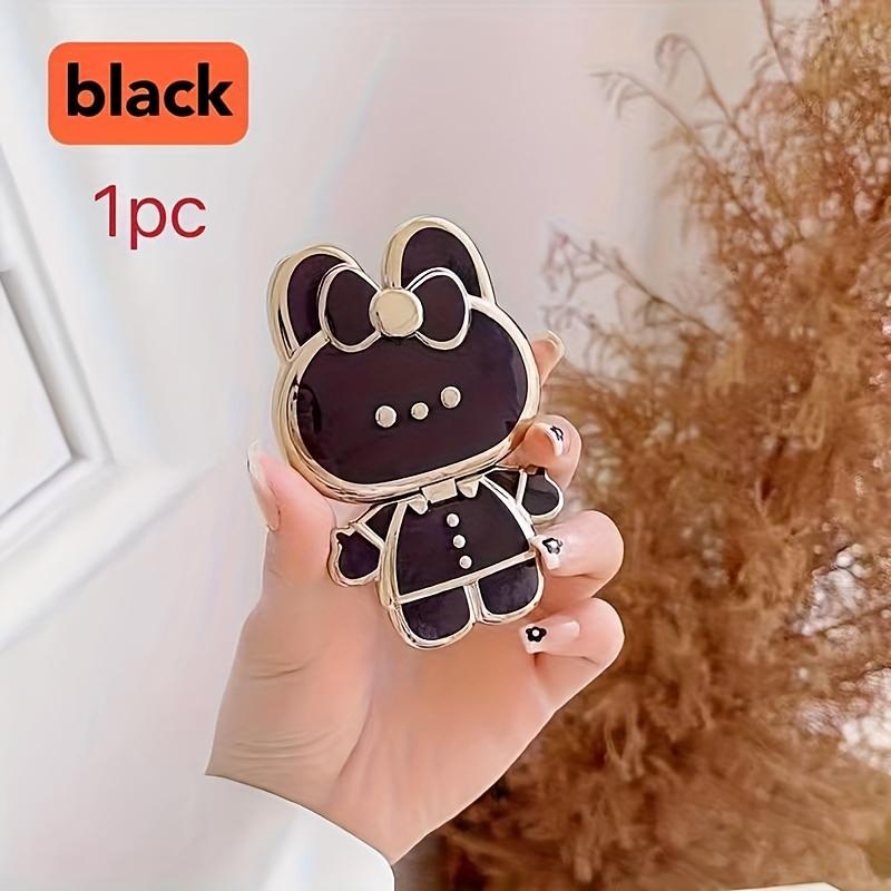 New rabbit-shaped adhesive phone stand with makeup mirror is suitable for iPhone, Samsung, Xiaomi phones, and various other phones. The rabbit phone case desktop stand is a hollow-out lazy stand