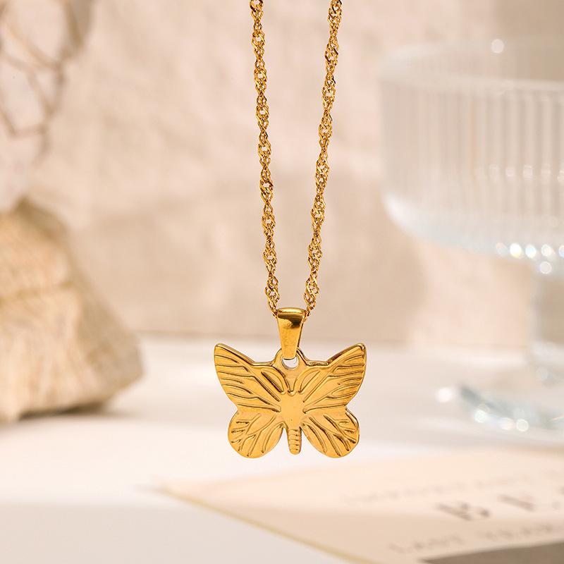 European and American embossed necklaces, niche luxury heart-shaped Cupid pendants, stainless steel sweater chains, vintage titanium steel accessories