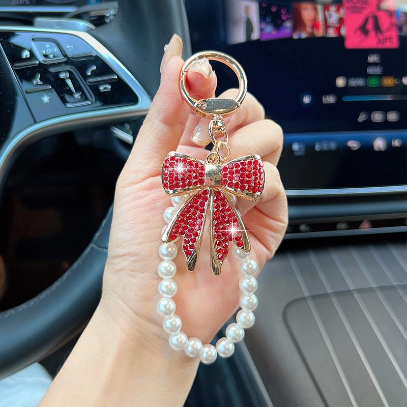 Rhinestone Bow Keychain with Pearl Wrist Strap, Luxury Bling Bow Car Key Ring, Elegant Metal Bag Charm Accessory for Women