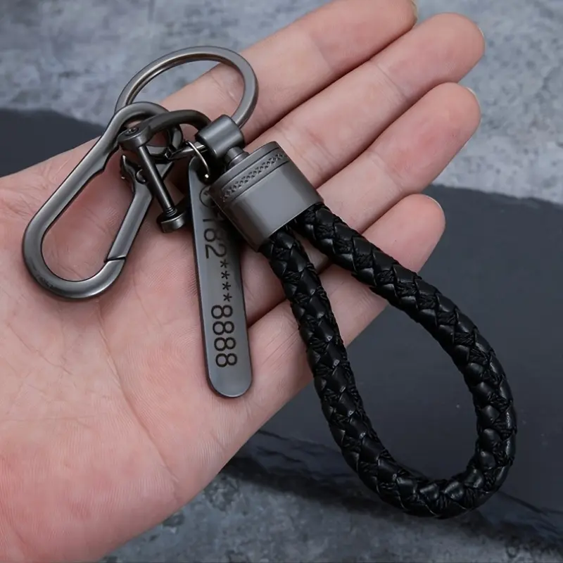 A personalized engraved car keychain pendant for men, featuring a high-end rope belt lock, a keychain made of woven rope, and a key for preventing loss while riding a motorcycle.