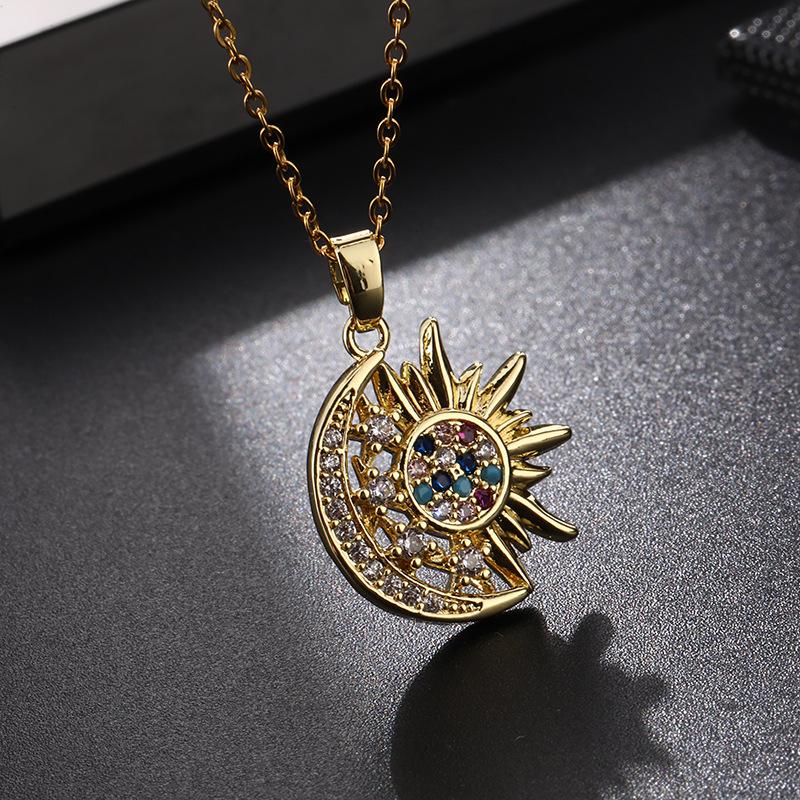 A 2-Piece Set: Sun and Moon Necklaces Adorned with Colorful Cubic Zirconia. Featuring a vintage-inspired design, this set embodies a blend of unique personal style and minimalist trends. It makes an ideal gift for sisters or classmates, and is equally per