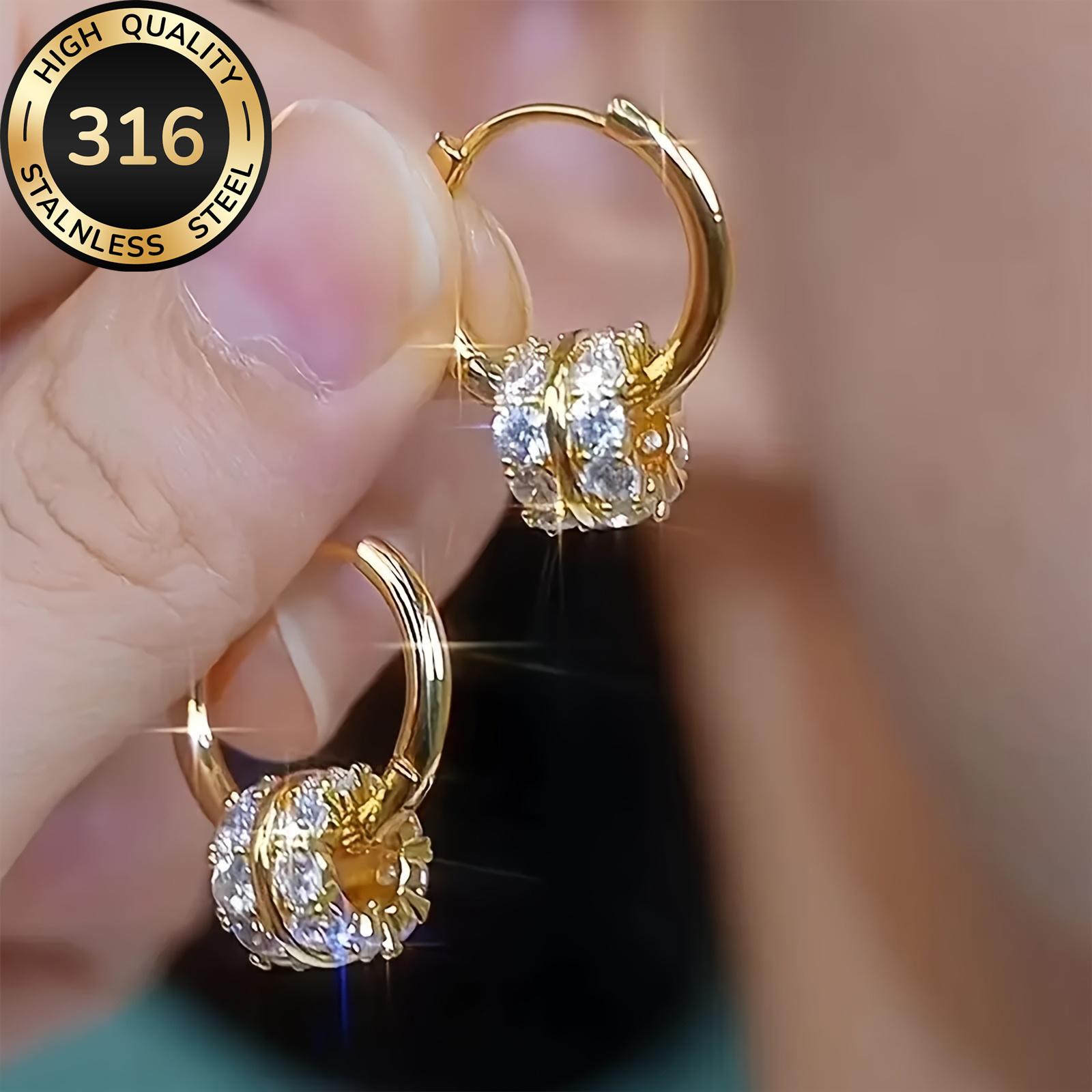 A pair of luxurious hoop earrings made of hypoallergenic 316 stainless steel with synthetic zirconia stones, featuring a minimalist design, a jewelry gift for women.