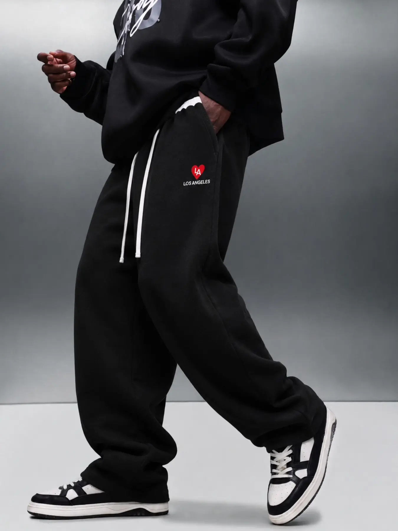Men's Black Baggy Wide-Leg, Uncuffed Sweatpants, Drawstring Pants with Small Red Heart Graphic, Elastic Waist, Side Pockets and Relaxed Straight Legs, Retro Y2K Streetwear for Campus, Skate, Travel, Music Festivals, Casual Weekends