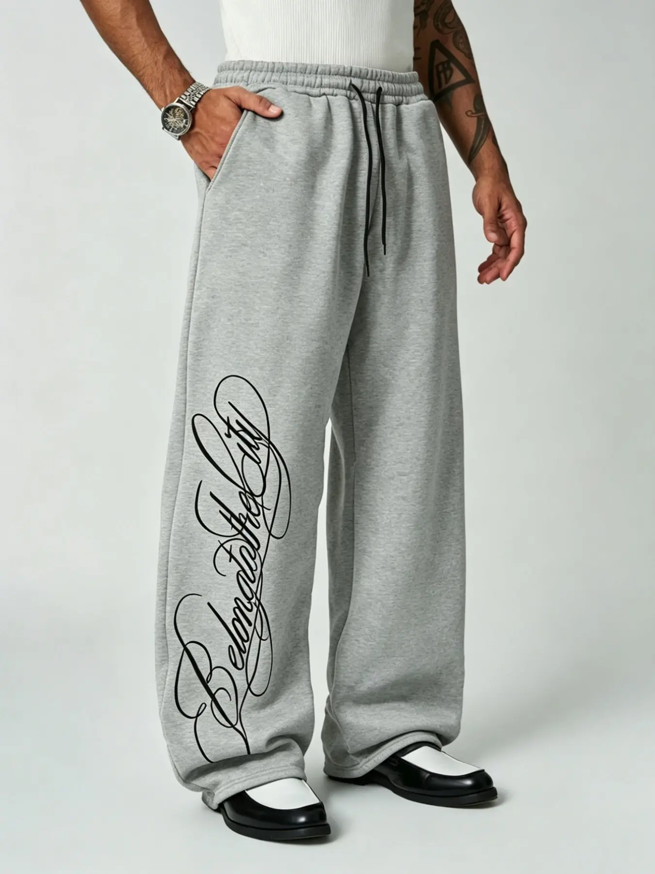 Men's Y2K hip-hop wide-leg sweatpants, Casual streetwear trousers, loose skate casual trousers with drawstring elastic waist and large-capacity side pockets, vertical signature print design on pant sides, soft stretch solid black loose street pants