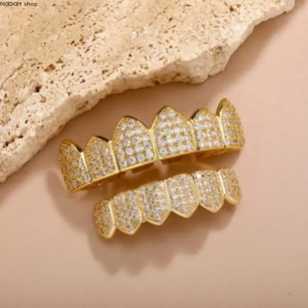 Iced Out Fang Teeth Grillz with Cubic Zirconia, Hip Hop Mouth Jewelry in Gold & Silver, Bold Statement Dental Accessories for Rappers & Parties, Teeth Accessory