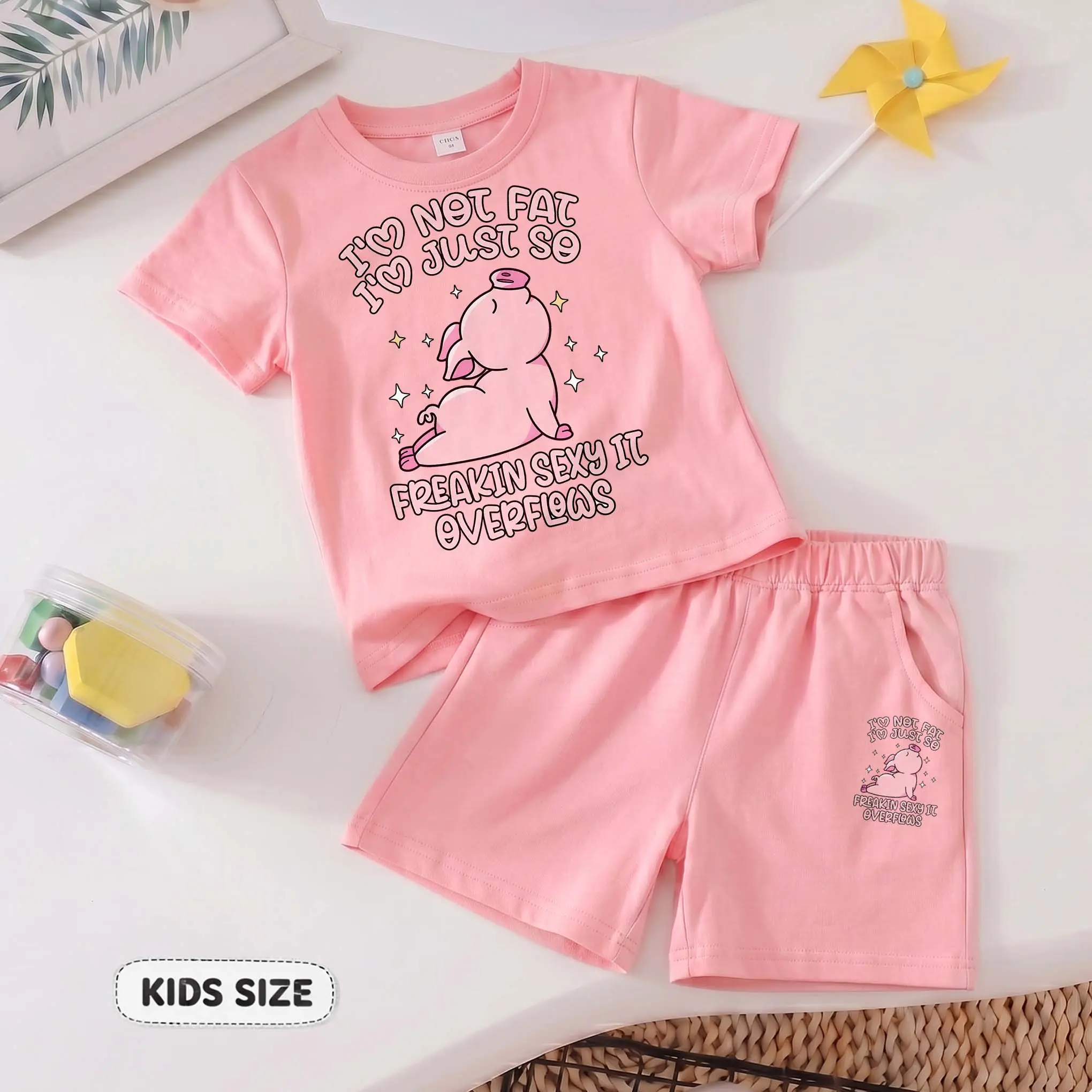 Kids’ I'm Not Fat I'm Just So Freakin Sexy It Overflows Cartoon Print Short-Sleeve T-Shirt And Shorts Set—Casual Summer Kids' Clothing. This Round-Neck Outfit Combination Is Perfect For Everyday Wear And Outdoor Play.