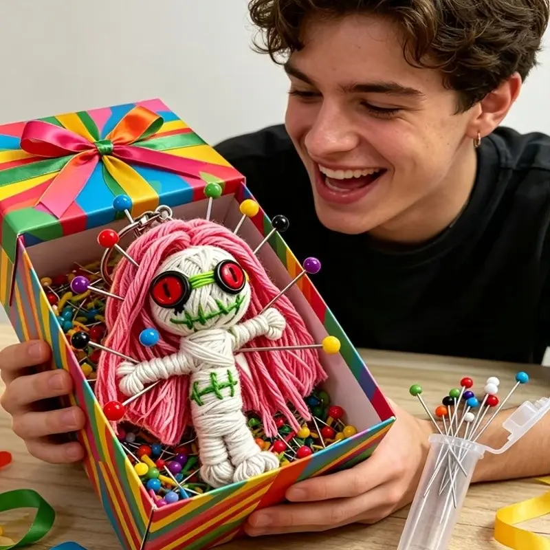 Fun Prank Handmade Crochet Voodoo doll  (12 Needles with Random Colors), A Black Humorous Gift for Prankishing Colleagues, Friends, And More. Perfect for Halloween, Joke Parties, White Elephant Gifts