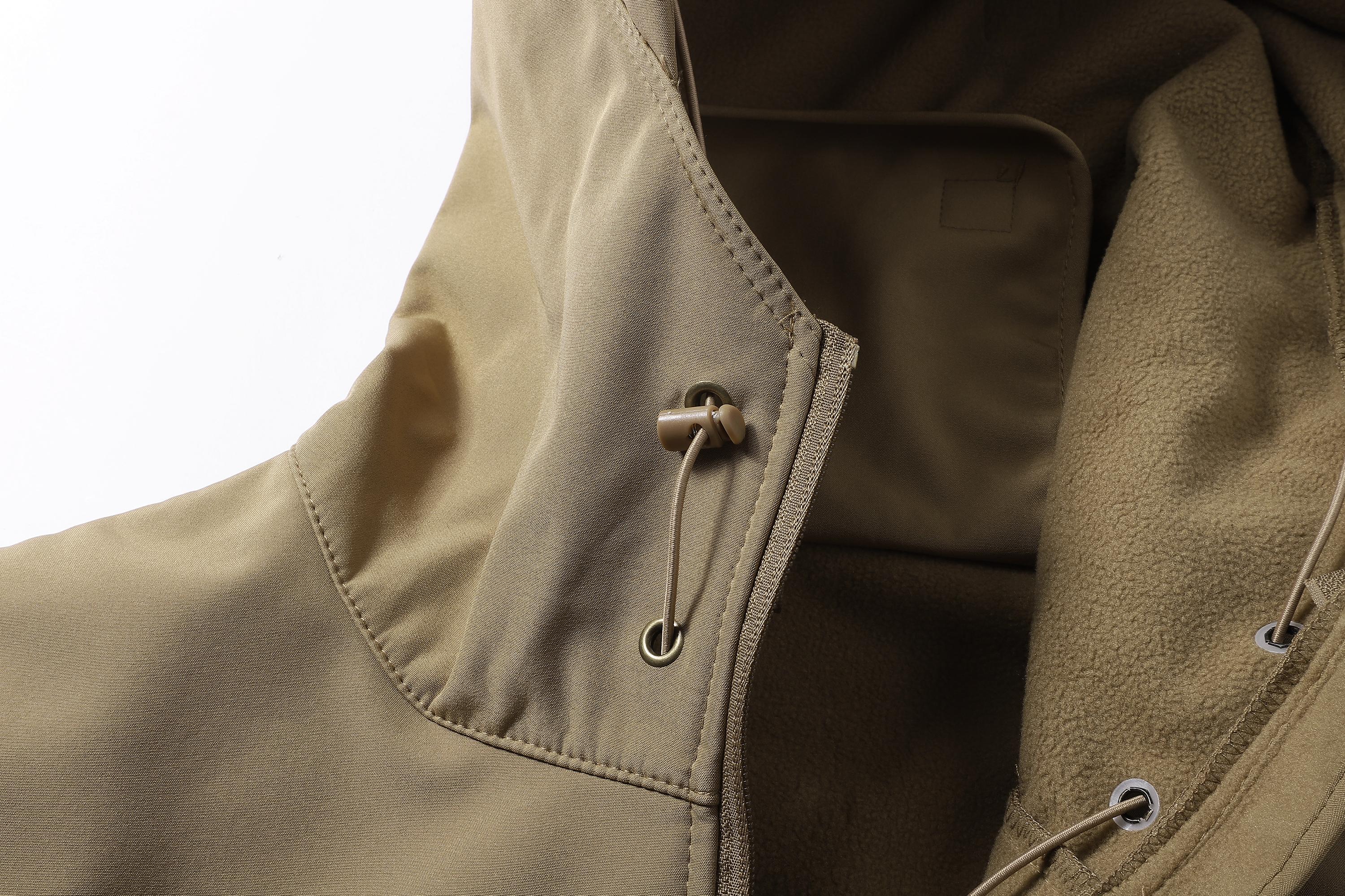 A men's hooded jacket with an outdoor and functional style features multiple zipper pockets distributed on the chest, arms, etc., making it convenient to store various small items and highly practical. Hood with drawstring closure