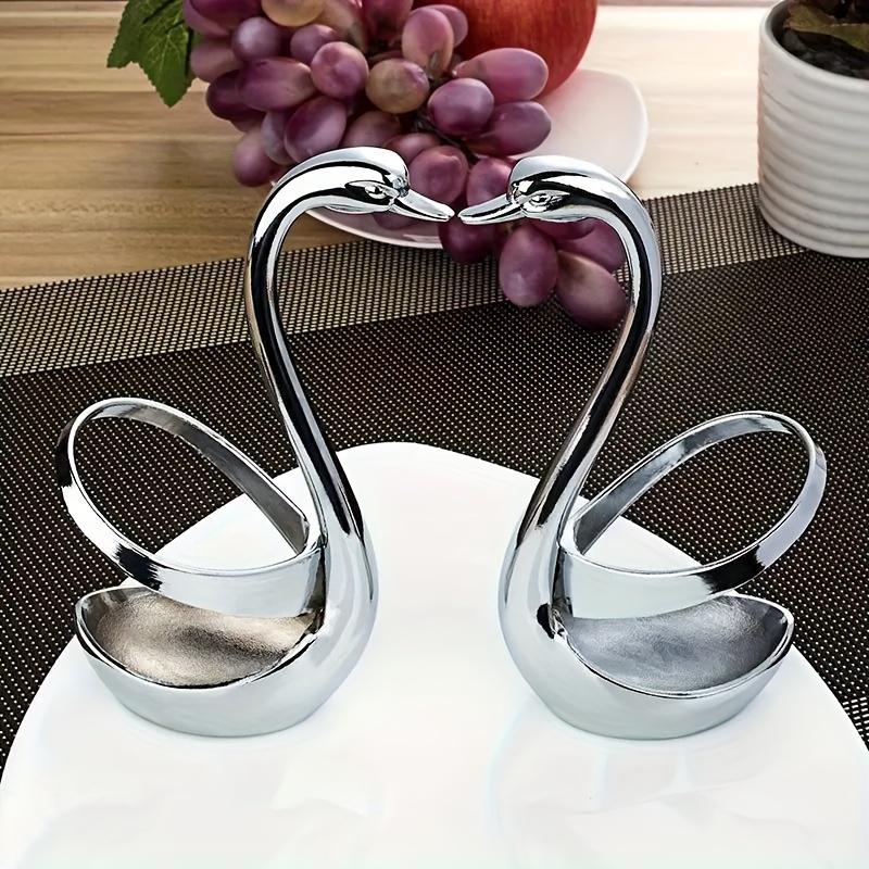 A 7pcs Stylish Cutlery Holder Designed Like a Swan, Including One Swan And Three Forks And Spoons Made of Zinc Alloy. This Elegant Stainless Steel Cutlery Rack Comes with a Complimentary Set of Forks And Spoons