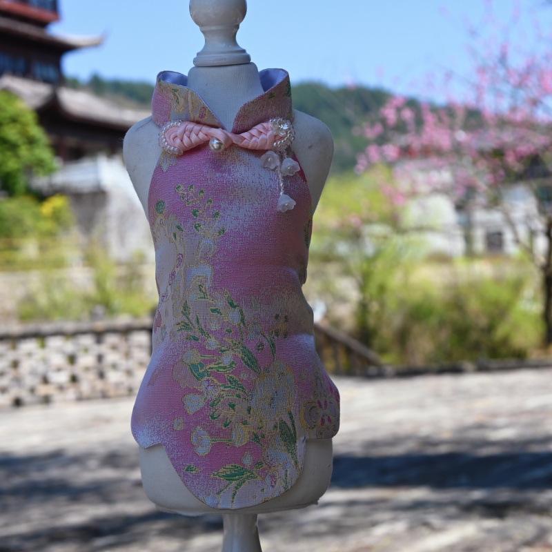 Paws Trendy Pet Spring & Summer Qipao for Dogs & Cats, suitable for Teddy, Bichon Frise and other small dogs. Features embossed fabric with exquisite retro frog buttons, fine workmanship, exuding noble elegance and making your beloved pet stand out.