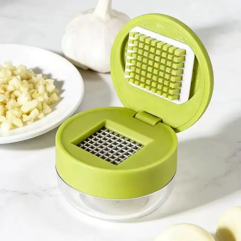 Joie Dual-Use Meal Prep Tool - Compact Round Shape Single Unit Kitchen Garlic Press & Chopper Utensil with Stainless Steel Blades, Included Storage Container, Green