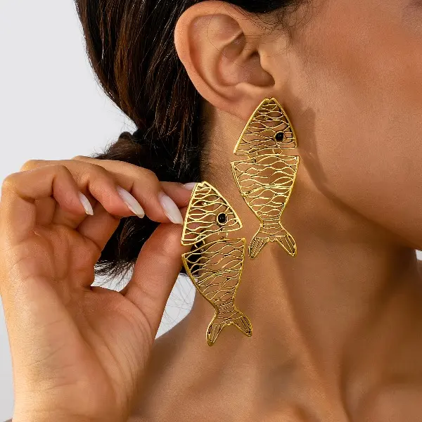 A pair of unique creative piecework hollowed-out small fish goldfish earrings, simple and versatile bohemian style, perfect for everyday outfits and fun gifts