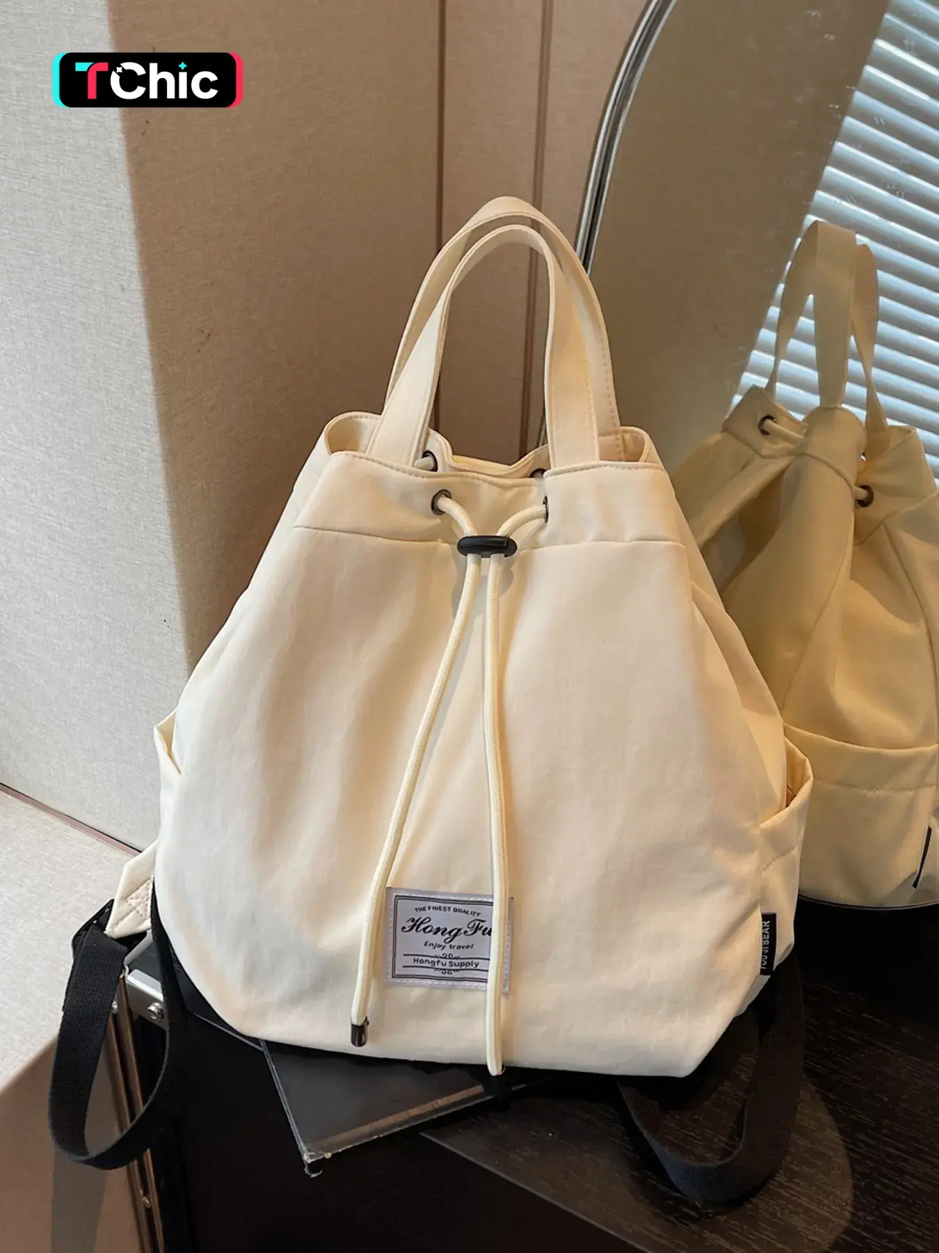 Fashionable solid color casual and relaxed backpack, simple and atmospheric large capacity versatile backpack, drawstring pocket design, can accommodate books and documents, suitable for daily commuting and shopping