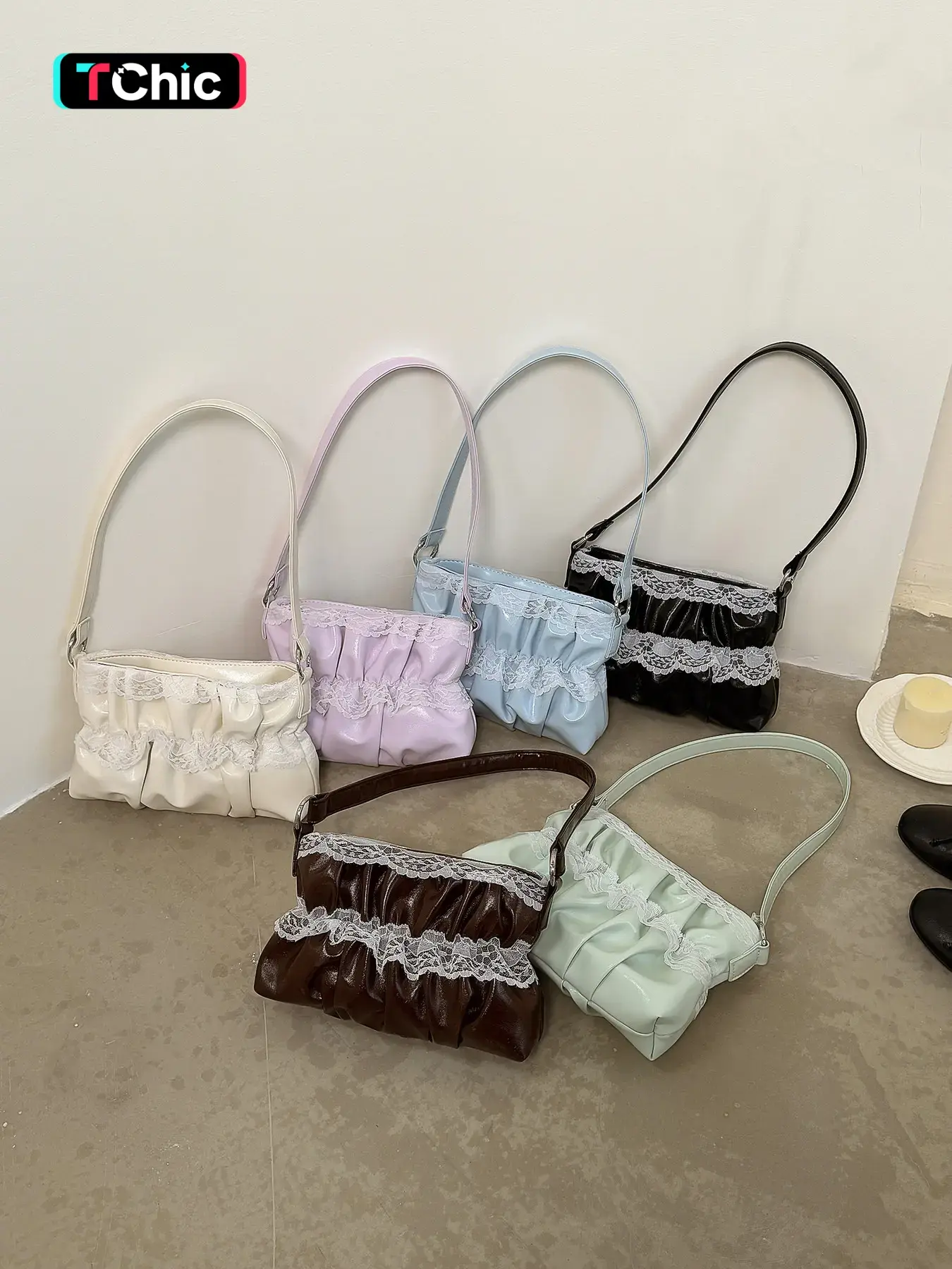 Pleated drawstring handbag, double-layered lace trim on top and bottom for added elegance, reasonable interior space for storing keys and lipstick, a versatile and exquisite short- underarm bag.