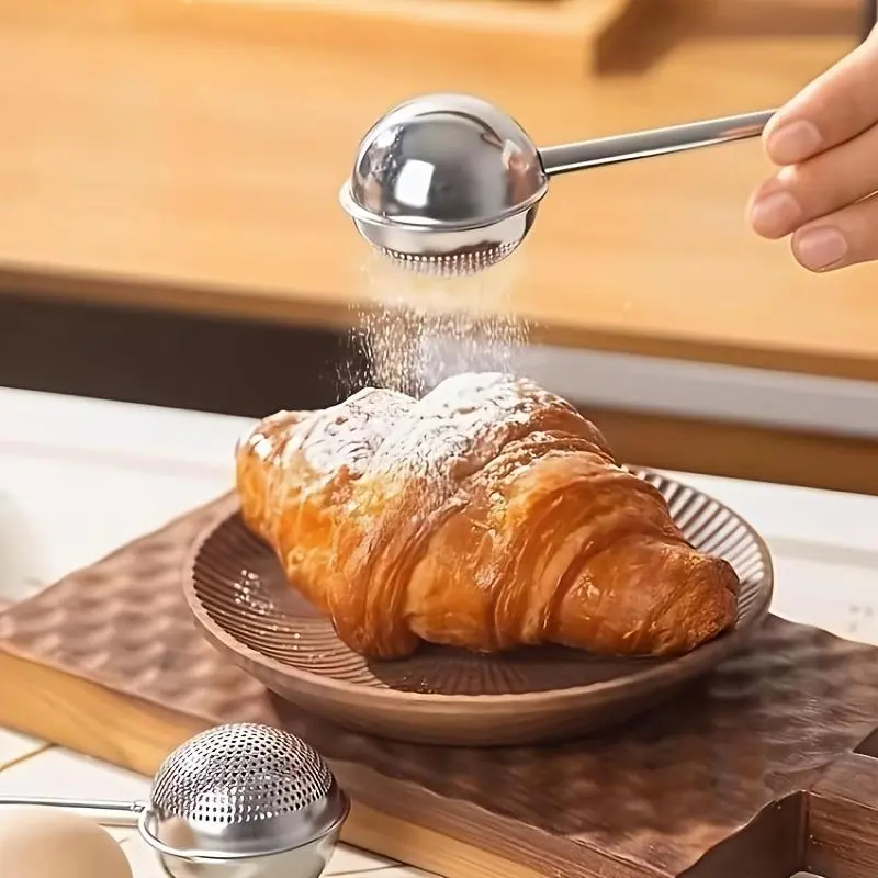 A Stainless Steel Baking Sifter for Sifting Sugar, Also Serving as a Loose Tea Dispenser, Powdered Sugar Shaker, and Dusting Powder Dispenser. The Three-in-one Design Allows for Easy One-handed Operation. Suitable for Kitchen Baking, Sifting Sugar