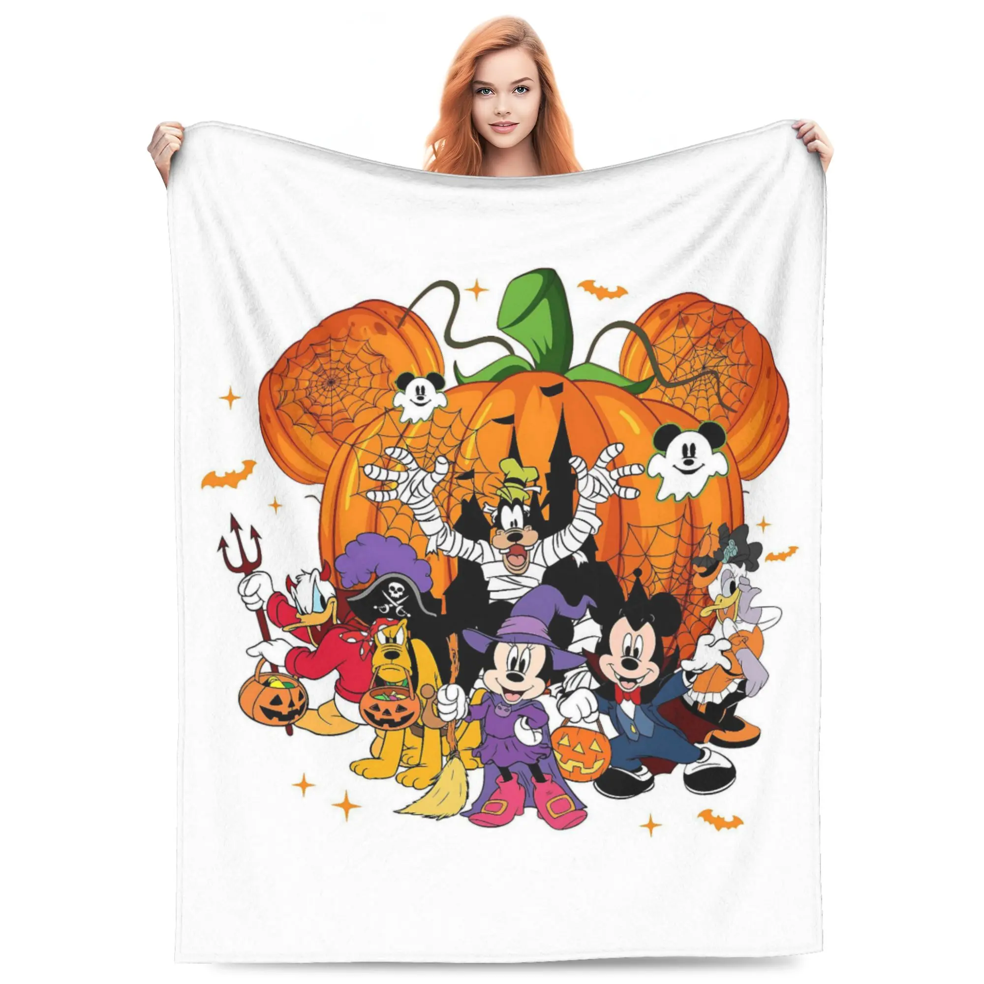 DISNEY CLASSIC Mickey Ear Pumpkin Crew Halloween Flannel Blanket. Mickey, Minnie, Pluto & friends in trick-or-treat costumes with bats and spider webs. Soft cozy throw, lovely seasonal gift for Disney Halloween fans.