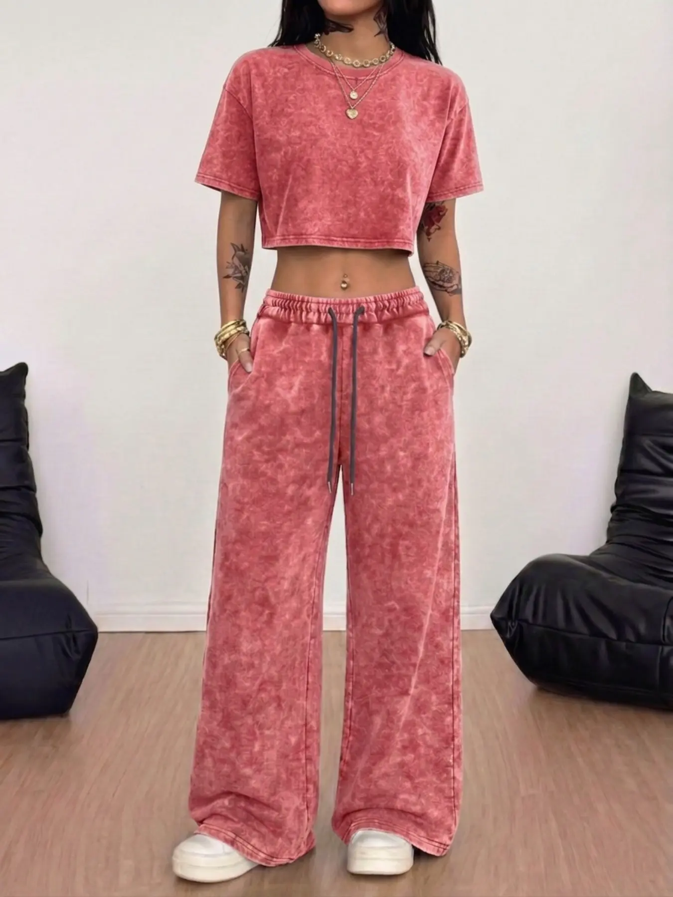 Multi-color distressed wash women's two-piece set—effortless American streetwear fashion style. Featuring a distressed cropped top and wide-leg pants, this set makes styling a breeze for a standout street-ready look.
