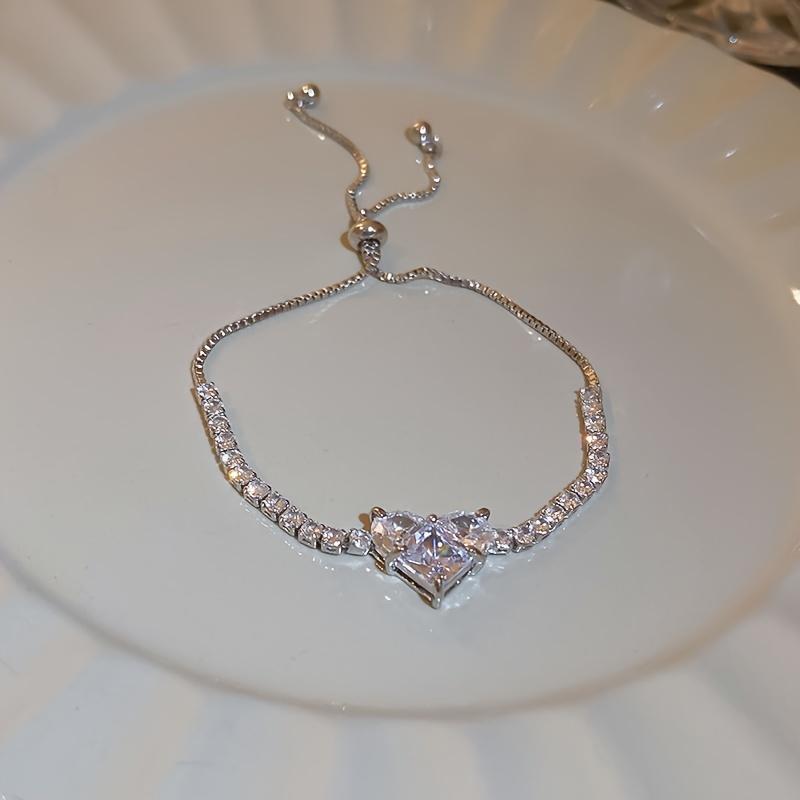 A Luxurious Heart-Shaped Adjustable Bracelet, Adorned with Zirconia - a Stylish Accessory Made of Copper, Perfect As a Gift for a Loved One, Partner, Or Best Friend