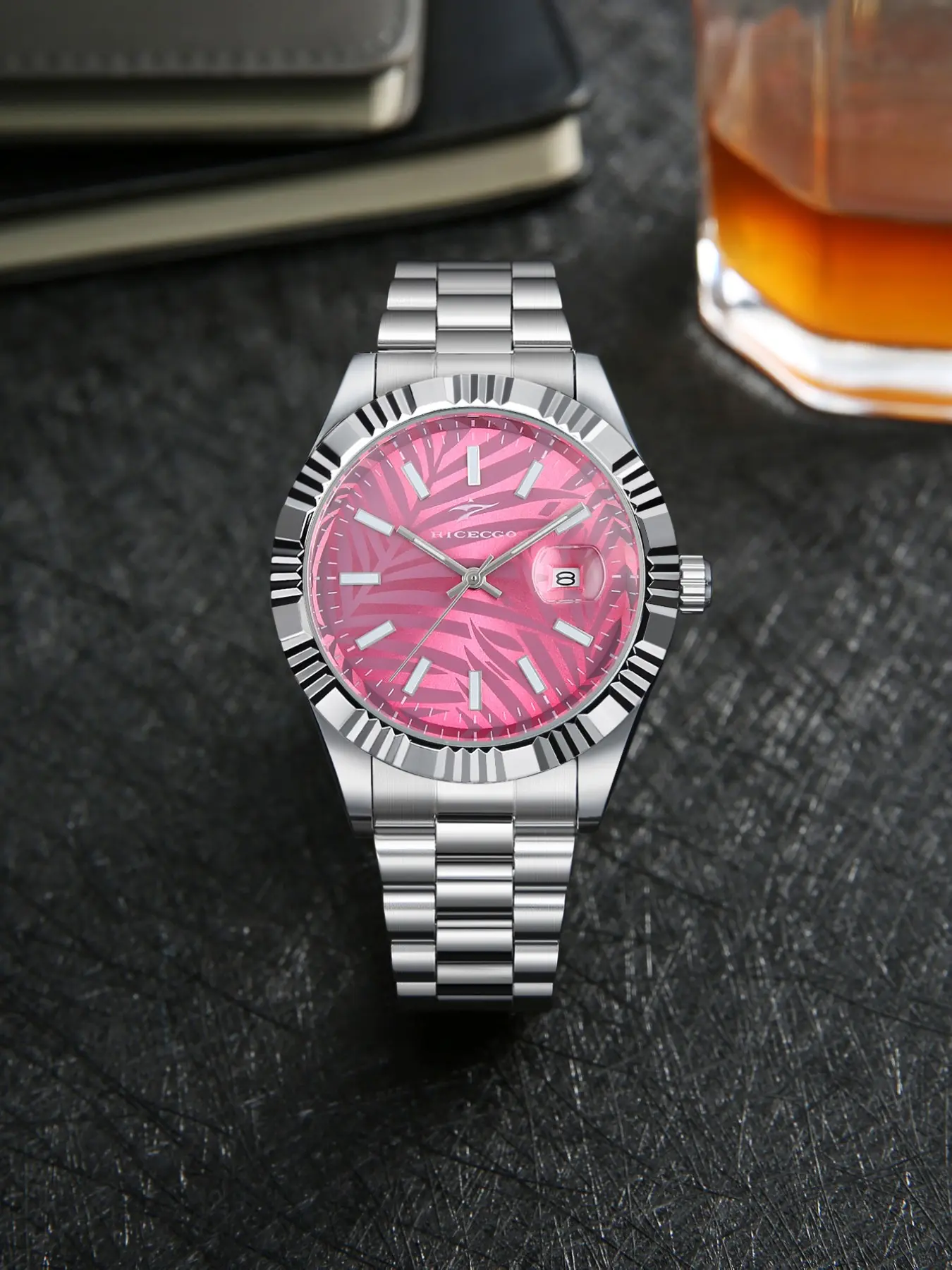 RICECGO: A men's affordable luxury business watch featuring a leaf-patterned dial, a stainless steel bracelet, and a date function—offering exceptional value for the price.