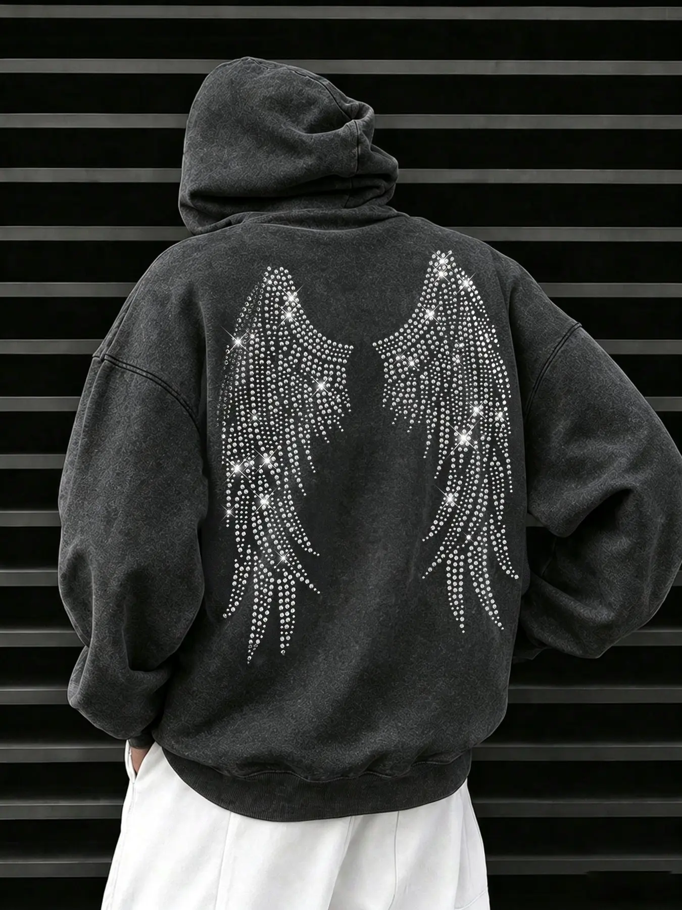 Lightweight, unlined sweatshirt featuring a distressed wash finish and cotton fabric; includes side pockets and a rhinestone-embellished chest design. A casual, everyday staple suitable for the transition between early autumn and early winter.