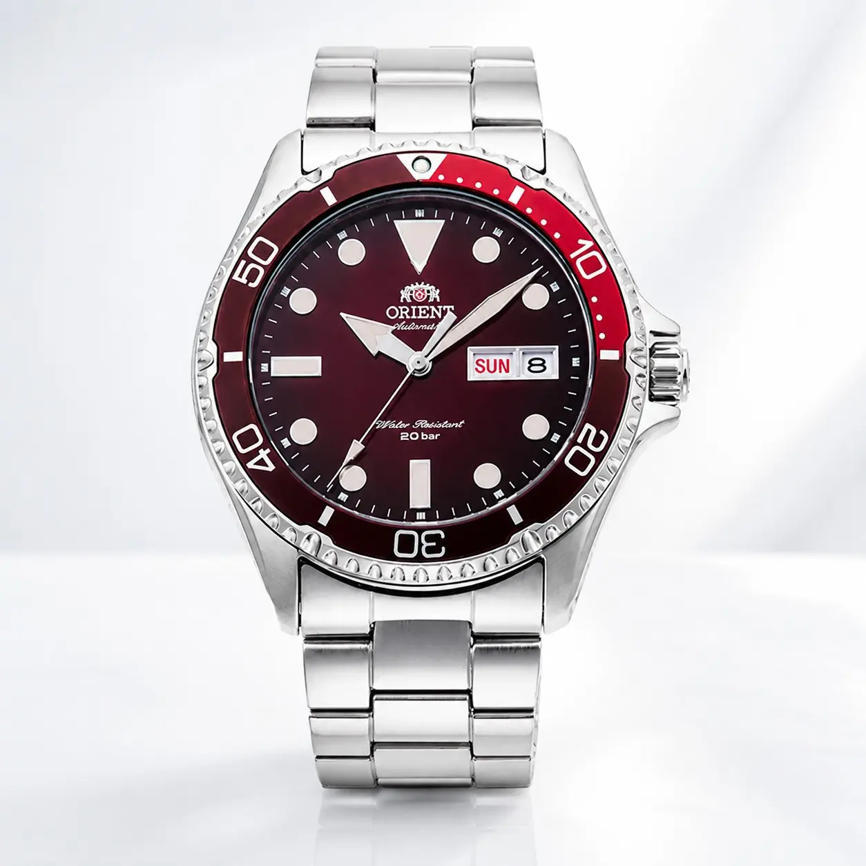 Original Japanese ORIENT red dial diver men's automatic mechanical diving watch.It is equipped with a unidirectional rotating burgundy timing bezel, a deep burgundy dial paired with highly luminous three-dimensional hour markers and hands.A dual-calendar
