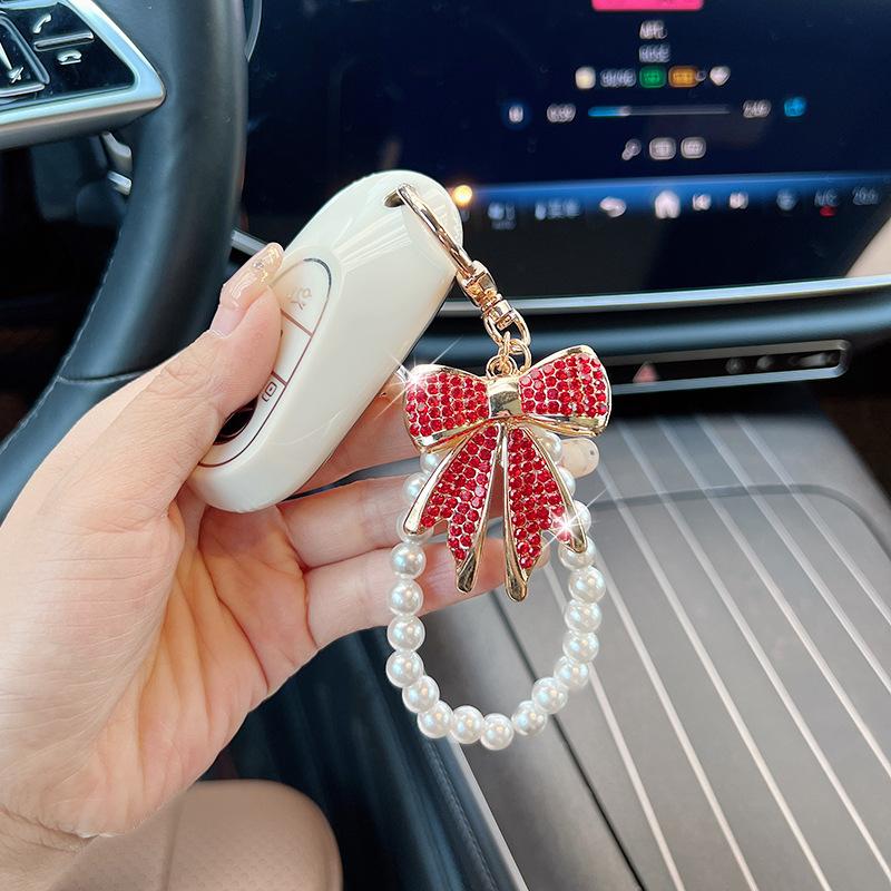Rhinestone Bow Keychain with Pearl Wrist Strap, Luxury Bling Bow Car Key Ring, Elegant Metal Bag Charm Accessory for Women Rhinestone Bow Keychain with Pearl Wrist Strap, Luxury Bling Bow Car Key Ring, Elegant Metal Bag Charm Accessory for Women