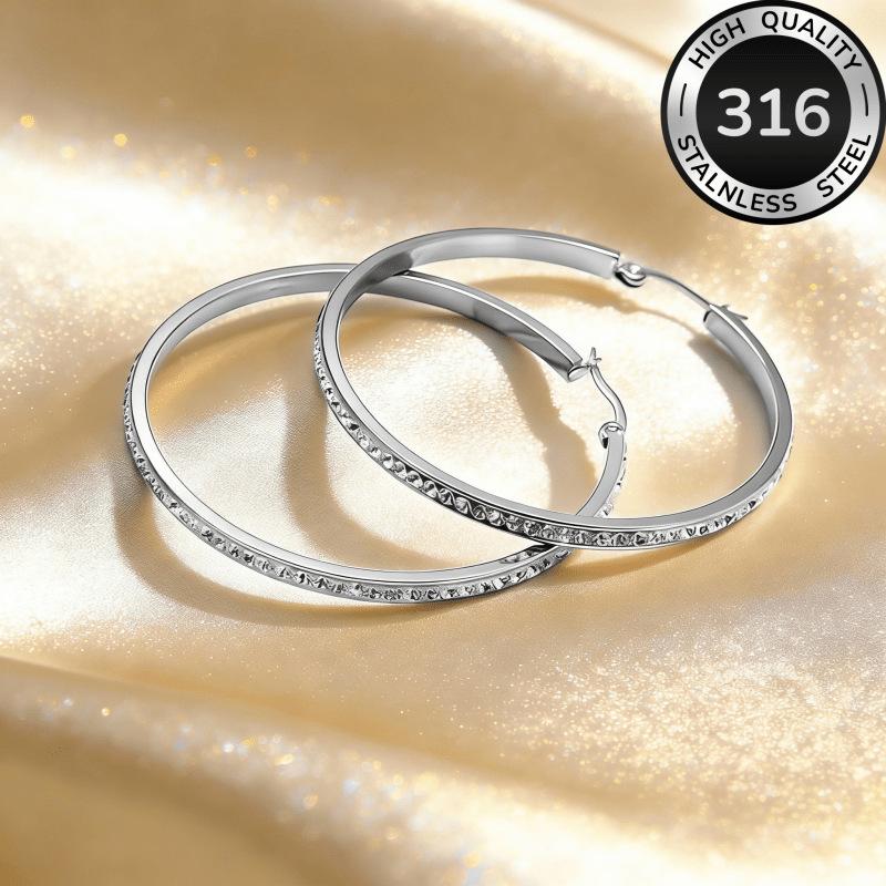 Round stainless steel diamond-encrusted earrings, a fashionable and light luxury accessory for women with large circular stud earrings