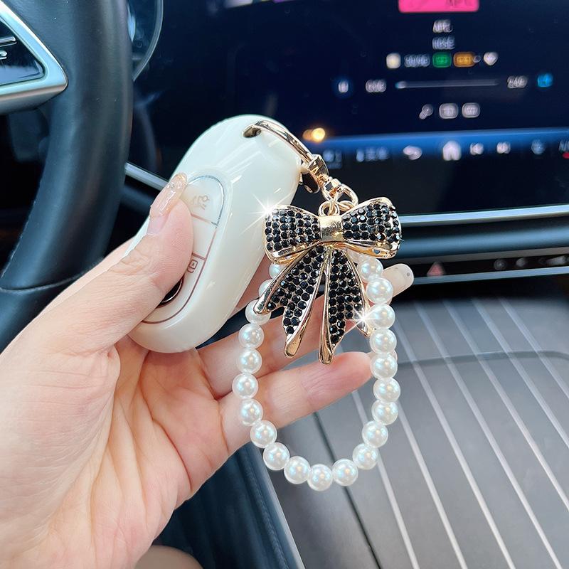 Rhinestone Bow Keychain with Pearl Wrist Strap, Luxury Bling Bow Car Key Ring, Elegant Metal Bag Charm Accessory for Women