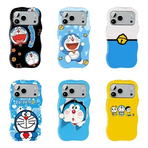 Doraemon cartoon wavy edge hard case phone case, featuring bells, stars, heart-shaped paper scraps, Nobita and Shizuka character prints. Durable and shockproof, suitable for iPhone 11–17 Pro Max/Plus series and Samsung Galaxy S23–S25 series.