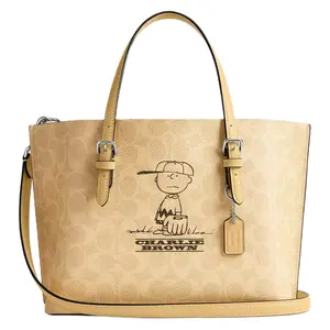 Coach x Peanuts Collaborative Molly 25 Tote Bag for Women – Coated Canvas, Cartoon Print, Silver and Hay Multi-Color