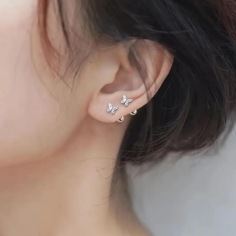 New handmade beaded pearl and rhinestone bracelet for women, Bohemian style, fashionable heart-shaped bracelet. Korean version. Fresh and elegant hollowed-out bow-shaped ear stud for women, screw fastened. Summer ear jewelry for women.