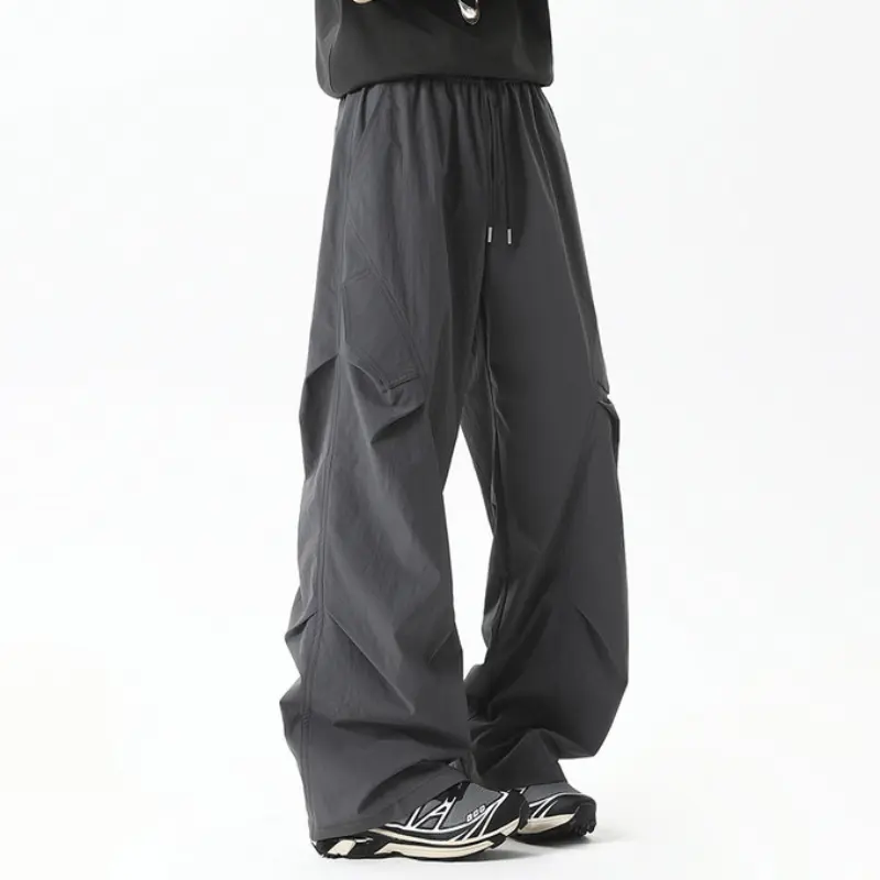 lightweight parachute cargo pants feature elastic drawstring waist, three-dimensional folded stitching on thighs, loose wide-leg drape silhouette and quick-dry fabric, suitable for daily casual wear and outdoor activities # sohochic