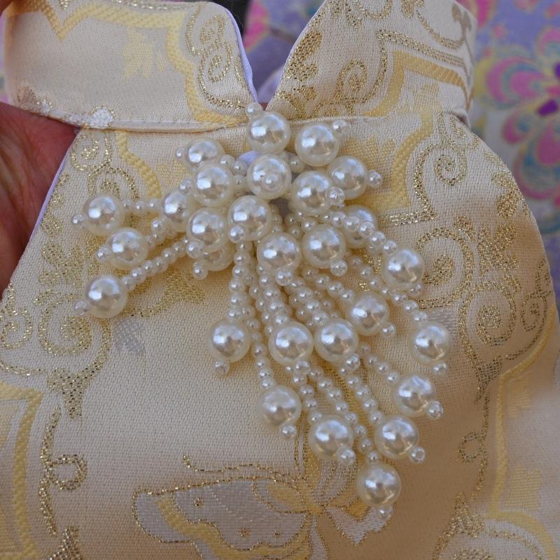 Paws Trendy Pet Spring & Summer Qipao for Dogs & Cats, suitable for Teddy, Bichon Frise and other small dogs. Features embossed fabric with exquisite retro frog buttons, fine workmanship, exuding noble elegance and making your beloved pet stand out.