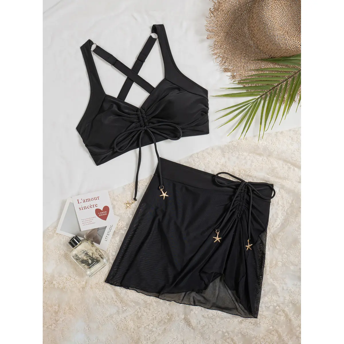 Two-piece bikini set featuring a mesh skirt with built-in bottoms and a drawstring; suitable for the beach and swimming outings.
