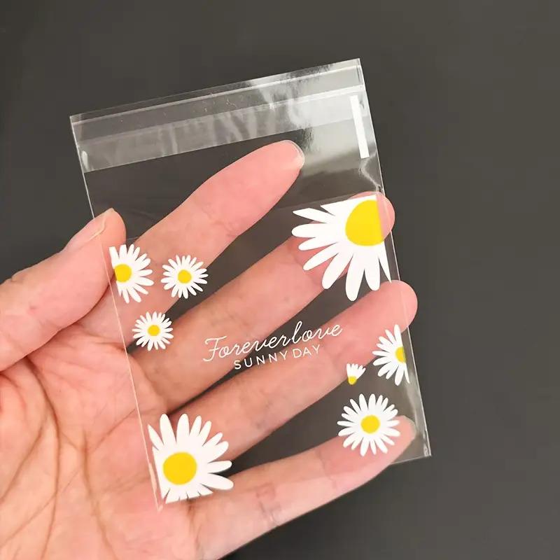 100pcs daisy print gift bag, transparent self-adhesive small packaging bag suitable for wedding return gifts, birthday tea parties, small gift packaging, independent packaging bags for biscuit baking all year round