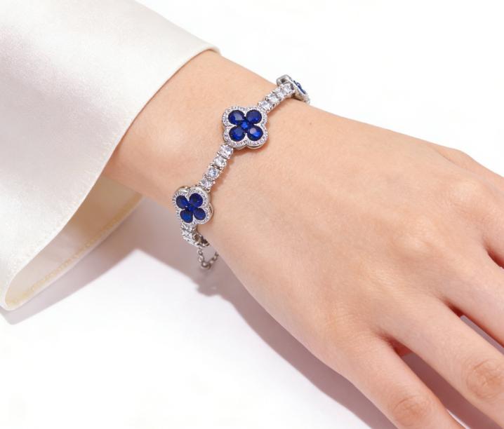 Paired with a 5A+ Sri Lankan Moissanite bracelet, featuring a four-leaf clover motif, colorful gemstone inlay, and a classic tennis chain design—crafted exclusively for women. This piece embodies a luxurious yet minimalist aesthetic, making it an ideal ch