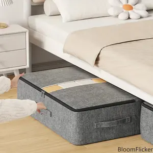 Zippered under-bed thick non-woven storage bag with dustproof PVC layer. Large sturdy pouch for quilts, blankets and garments, space-saving organizer for bedroom closet tidying