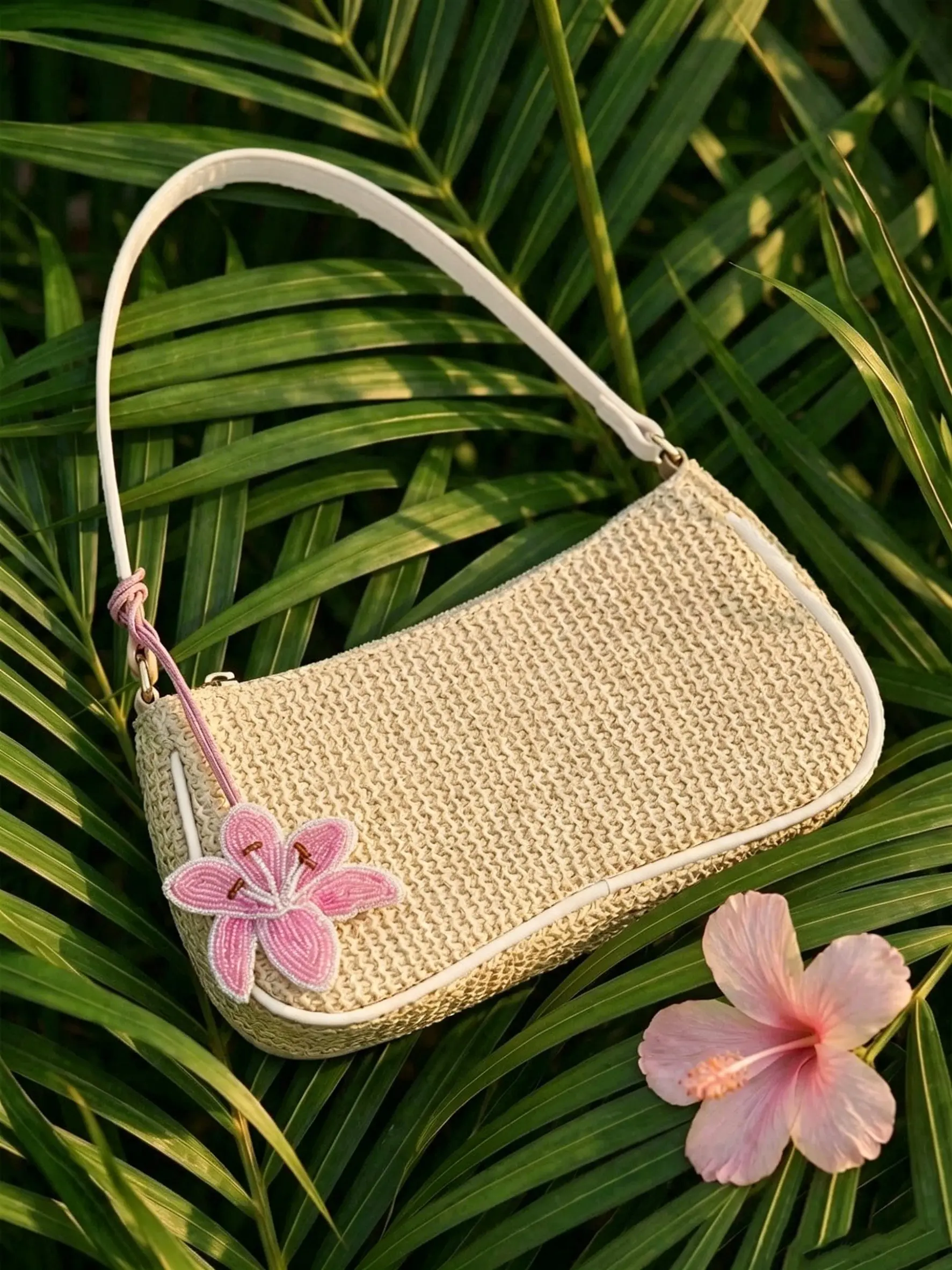 Minimalist beige Rafia woven rectangular handbag with handmade bead pink lily pendant, slim adjustable shoulder strap, lightweight Bohemian summer wallet, Boho shoulder bag, suitable for beach vacations, daily commuting, leisure outings