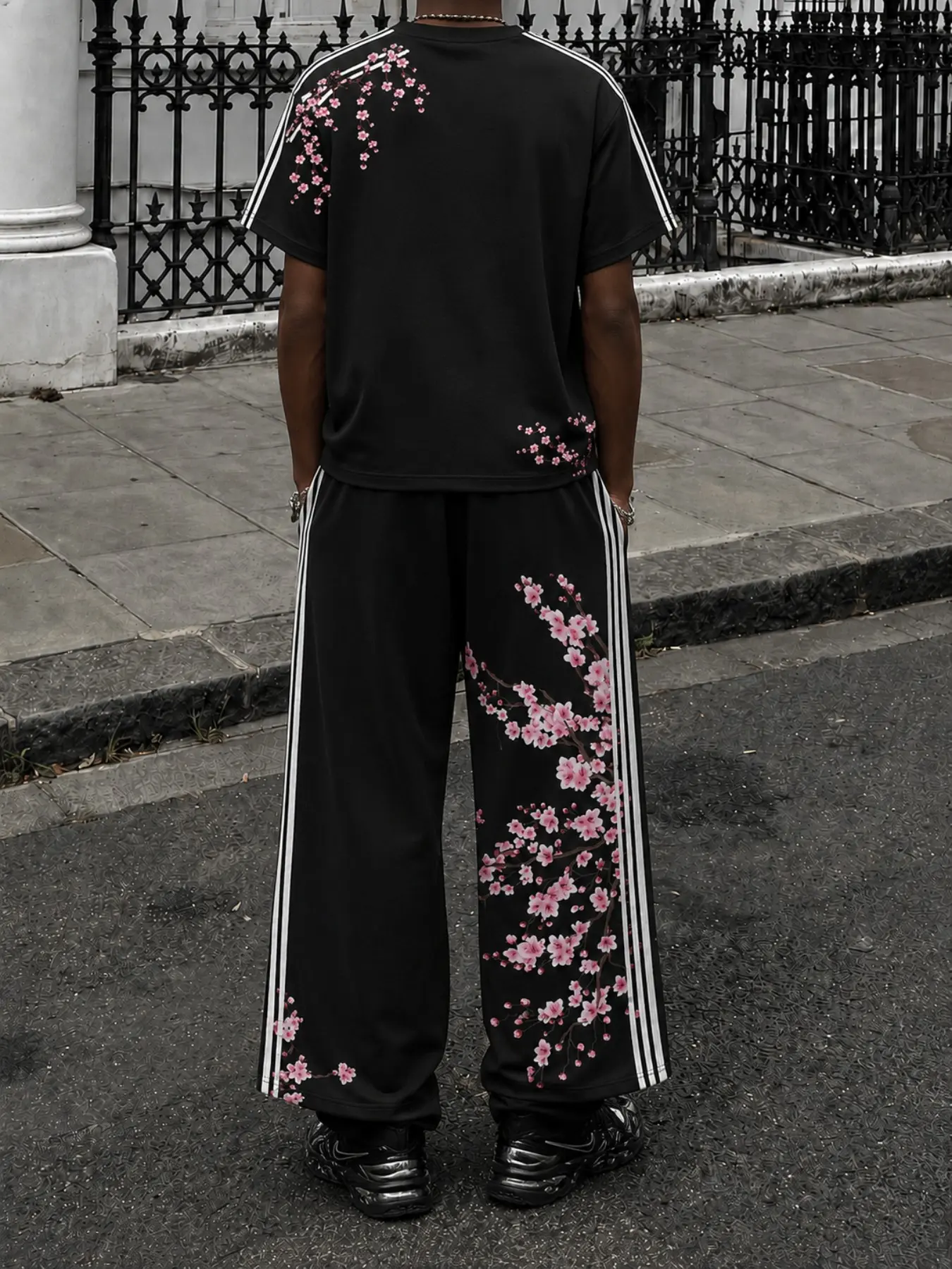 Men's Black Floral T-Shirt and Wide-Leg Pants 2-Piece Set, Menswear, Short Sleeve Tee and Drawstring Pants with Pink Blossom Prints, Side Stripes and Letter Details, Retro Y2K Streetwear for Campus, Travel, Festivals, Parties