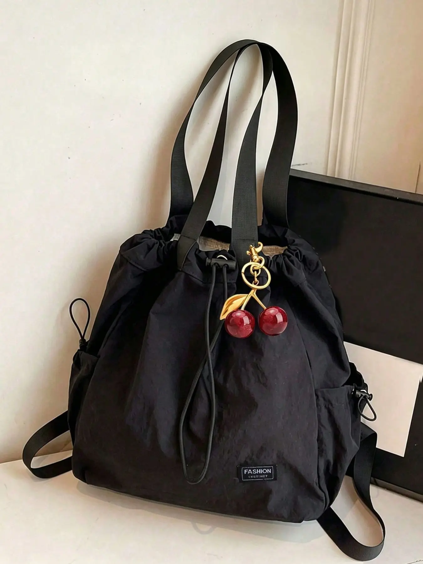 Relaxing retro minimalist pleated backpack, versatile and versatile with multiple carrying methods, large capacity practical texture backpack, with cherry pendant design, suitable for commuting to and from work, shopping
