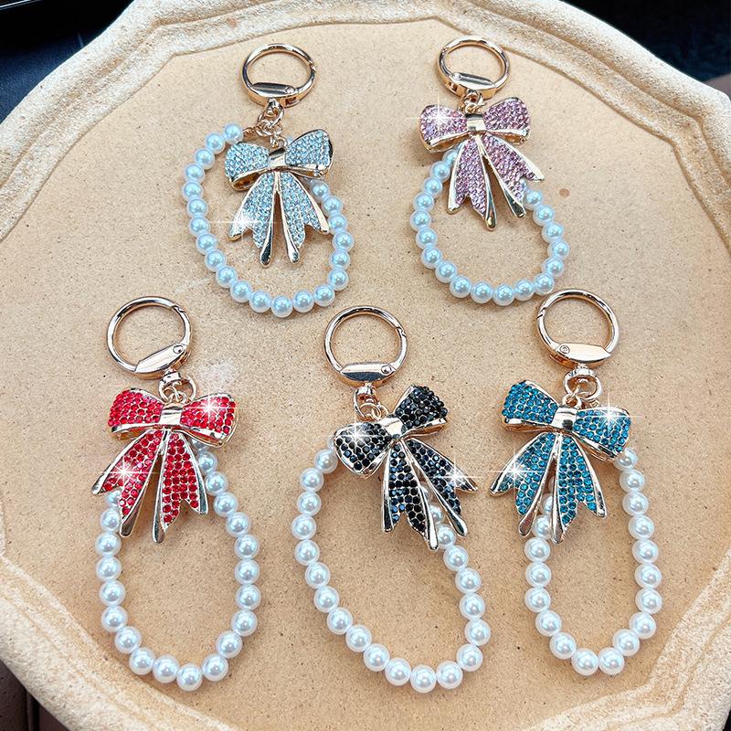 Rhinestone Bow Keychain with Pearl Wrist Strap, Luxury Bling Bow Car Key Ring, Elegant Metal Bag Charm Accessory for Women
