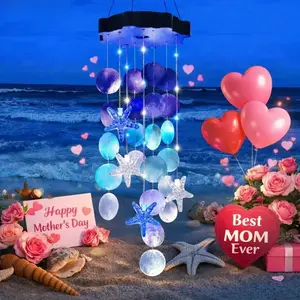 Solar Powered Seashell Wind Chime with Blue & White Starfish Lights, charming outdoor garden decor. Beautiful hanging ornament for yards and windows, ideal thoughtful Mother's Day gift for women.