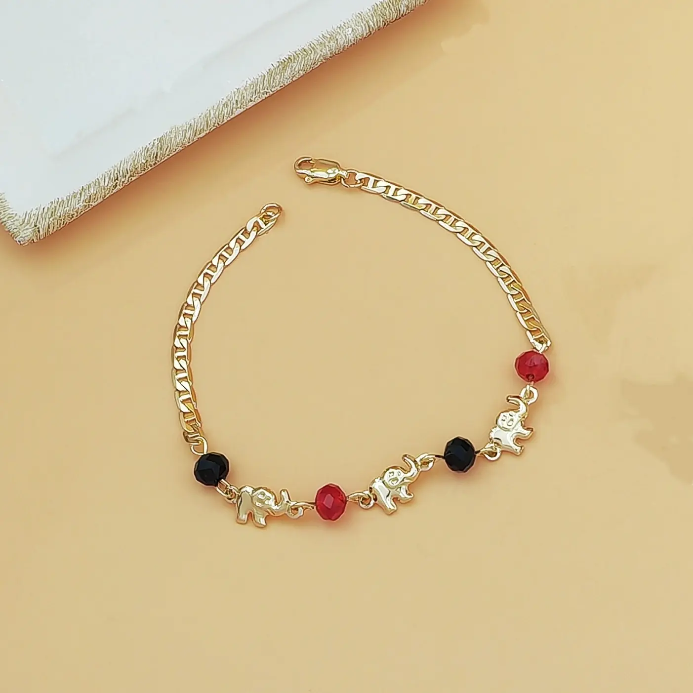 Bring good luck and style with this vintage gold elephant charm bracelet. Featuring exquisite tiny elephant details paired with vibrant red and black crystal beads. Lightweight durable and perfect for your daily jewelry stacking. Tap to shop.