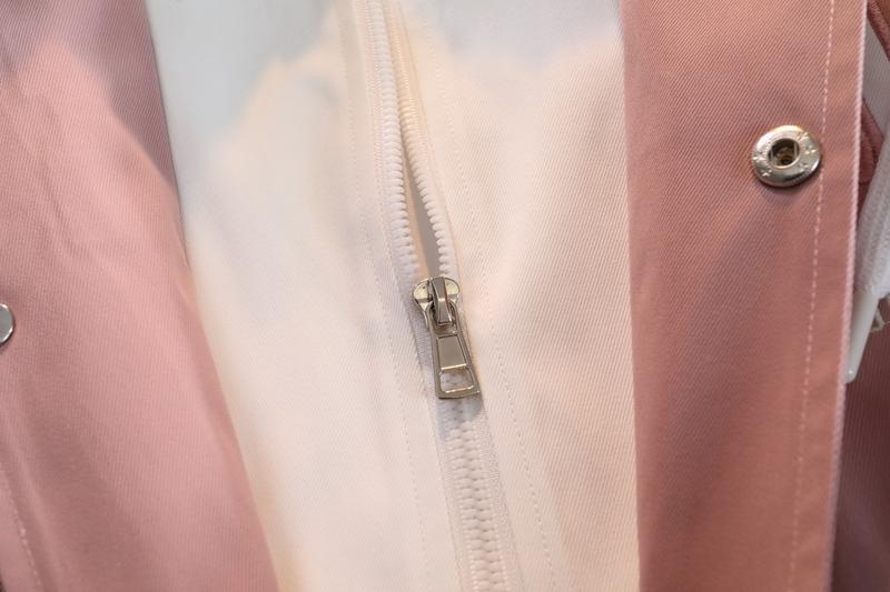 A hooded letter jacket, featuring a casual and simple style. The hooded design is sleek and elegant, while the overall design is practical and versatile. The letter embroidery adds a touch of sophistication, and the striped accent at the cuffs completes t