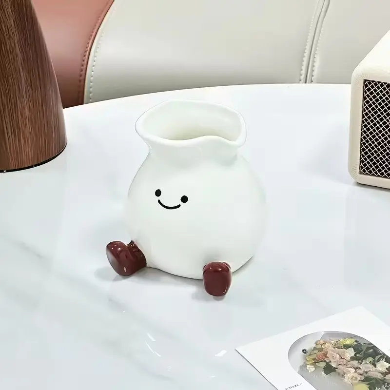 This creative ceramic toothbrush holder is perfect for home use in bathrooms and washbasins. The cute and minimalist smiley face ceramic vase is suitable for both home décor and adding a touch of style to any office space.