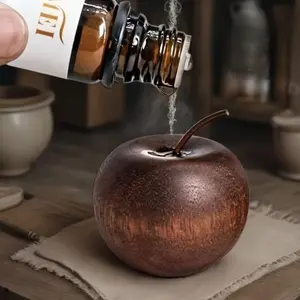 A wooden apple-shaped diffuser, suitable for use in both home and car, a decorative item for home tabletop, a natural wooden essential oil diffuser, and a festive decoration piece.