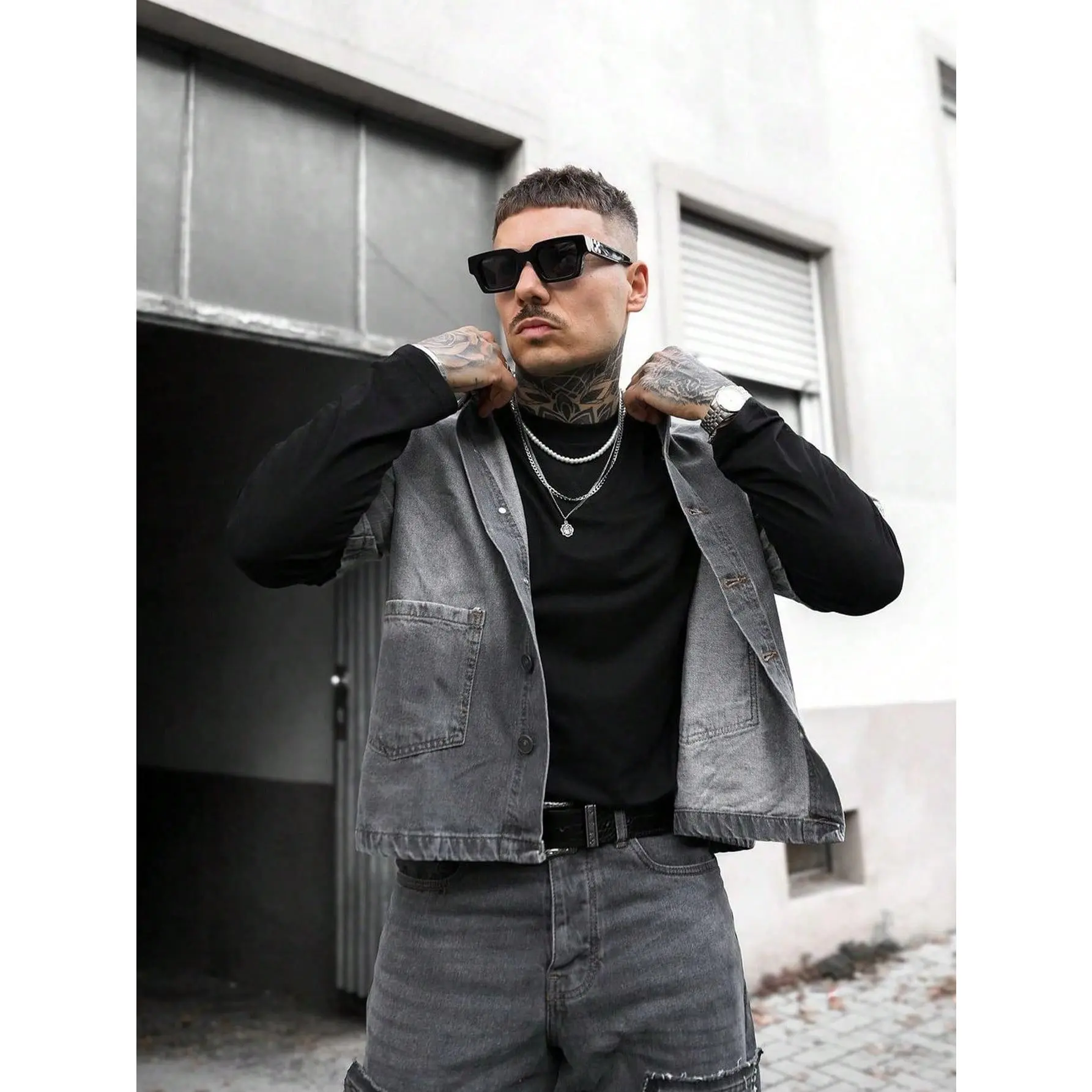 Cropped vintage washed denim trucker jacket with lapel collar, front button placket and dual patch chest pockets relaxed cropped silhouette minimalist layering outerwear staple for edgy urban modern mensfashion styling