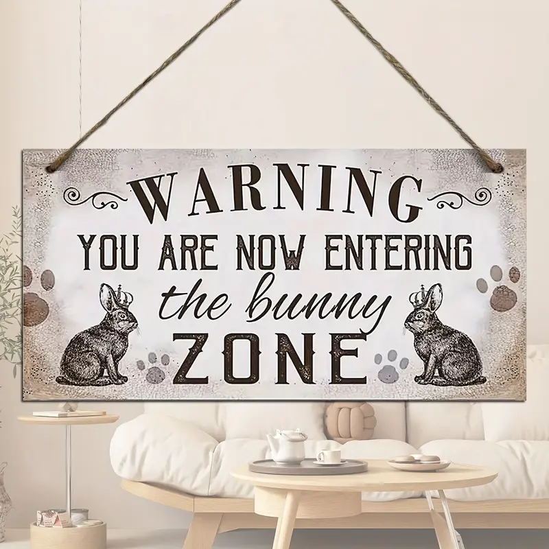 A wooden hanging decoration, warning you that you are now entering the Rabbit Zone, with a wooden sign hanging up as a reminder