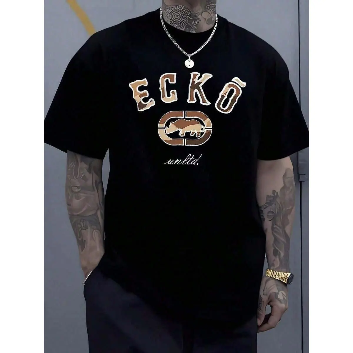 The Iconic ECKO Unltd Graphic Features A Bold Rhino Emblem With Urban Camouflage Lettering Symbolizing Strength Individuality Urban Culture And Authenticity 220g Tshirt|   Relaxed Fit|   Plus Size